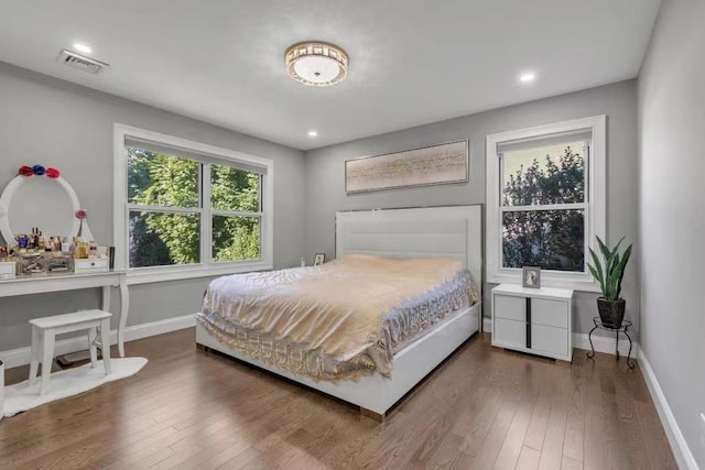 bedroom with hardwood / wood-style floors