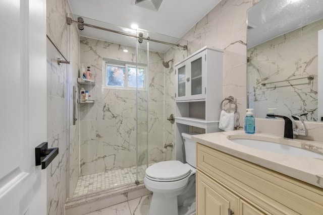 bathroom with toilet, a shower with door, and vanity