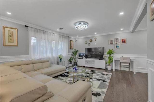 living room featuring ornamental molding and wood-type flooring