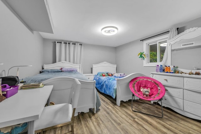 bedroom featuring light hardwood / wood-style flooring