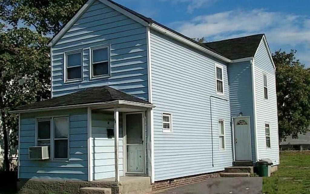 view of side of property with cooling unit