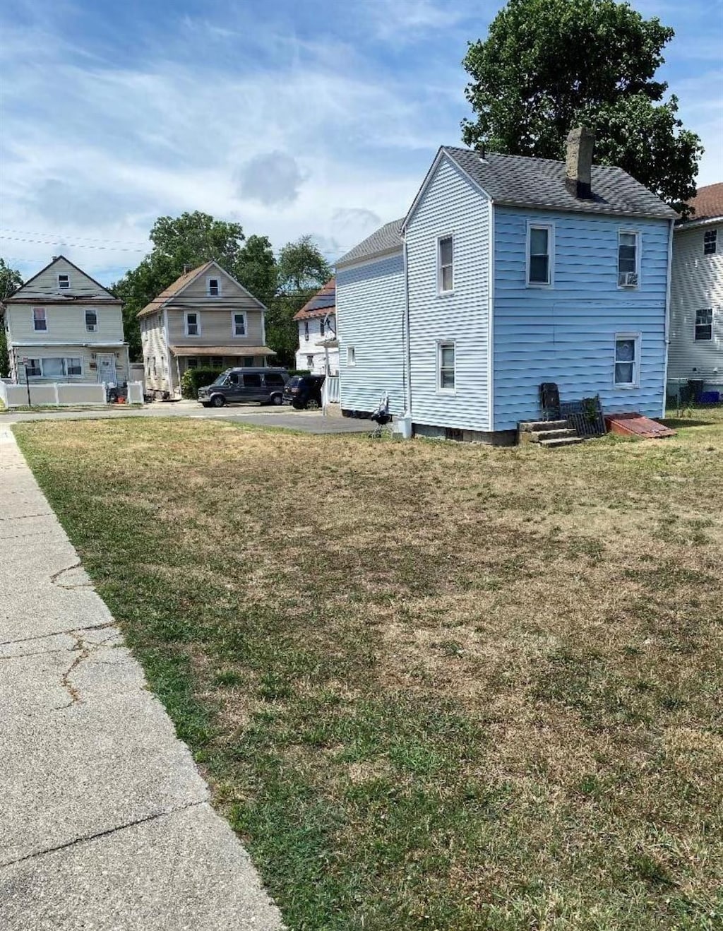 view of side of home featuring a yard