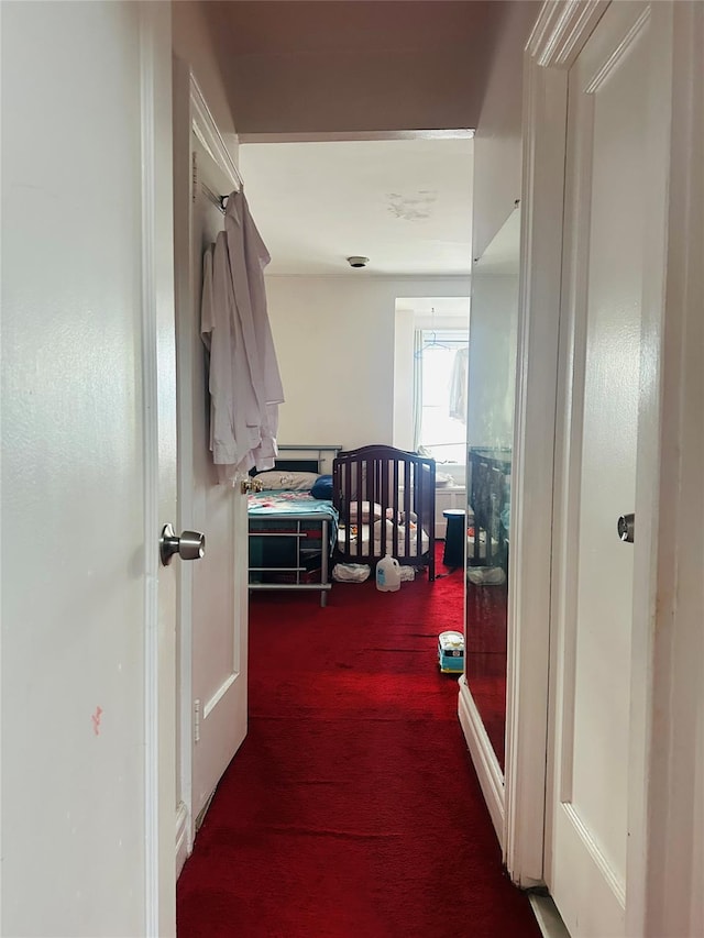 hall featuring carpet