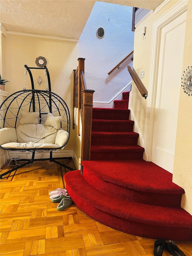 staircase featuring parquet flooring