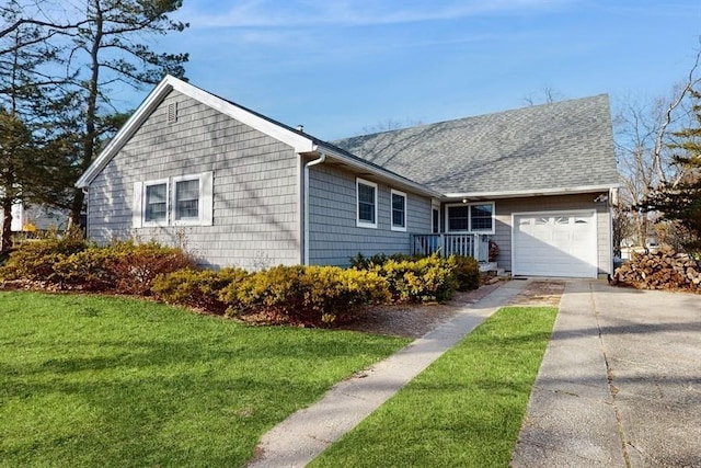 ranch-style house with a garage and a front lawn