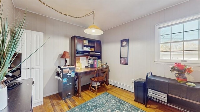 office with baseboard heating and hardwood / wood-style floors