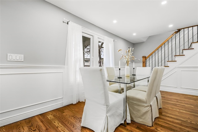 dining space with wood-type flooring