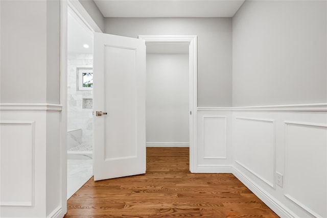 hallway featuring hardwood / wood-style flooring