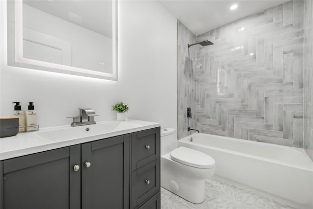 full bathroom featuring shower / bathing tub combination, vanity, and toilet