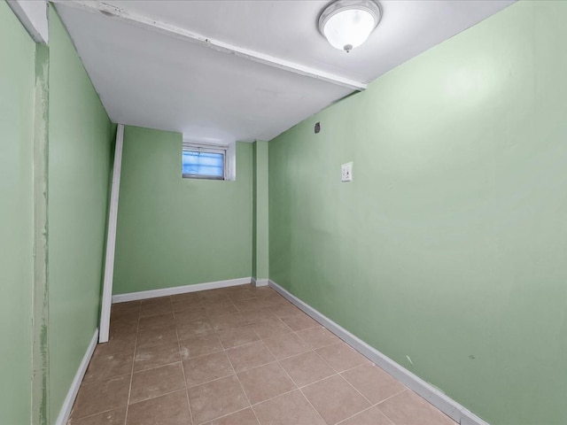 basement featuring light tile patterned flooring