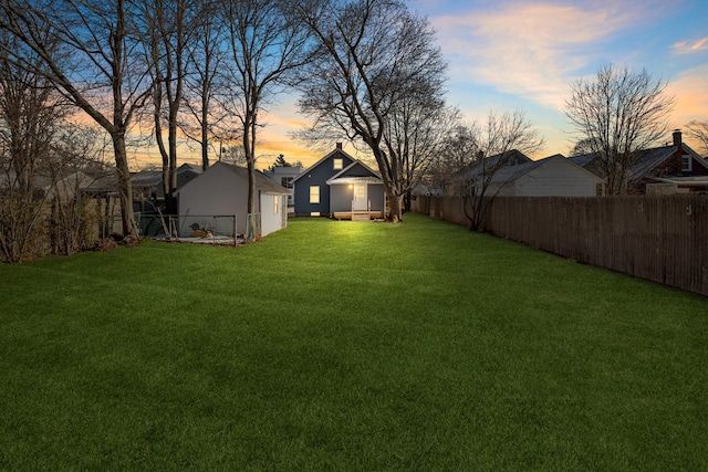 view of yard at dusk