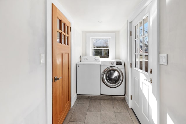 washroom with washer and dryer