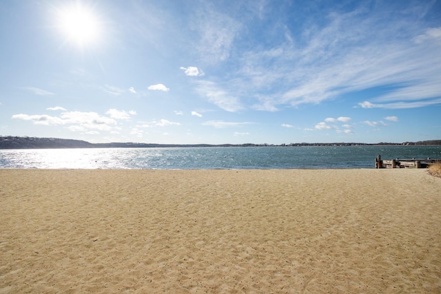 property view of water featuring a beach view