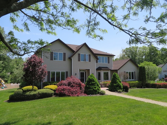 11 Balanchine Ct, Airmont, NY 10952 - view of front of house featuring a front yard and a playground