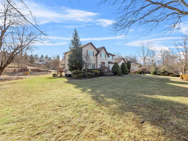 11 Balanchine Ct, Airmont, NY 10952 - view of home's exterior featuring a playground and a lawn