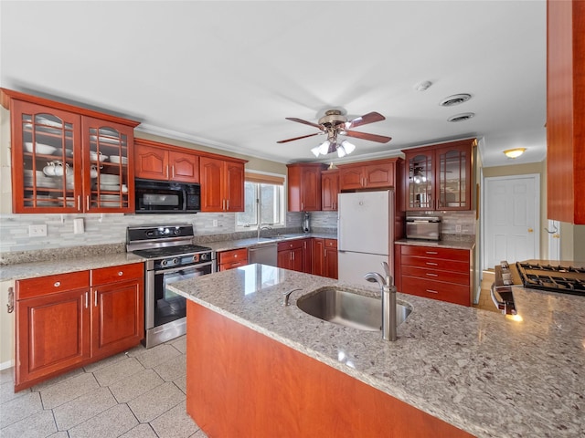 11 Balanchine Ct, Airmont, NY 10952 - kitchen with stainless steel appliances, a sink, light stone countertops, and tasteful backsplash