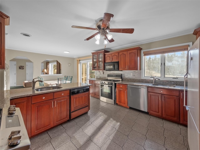 11 Balanchine Ct, Airmont, NY 10952 - kitchen with stainless steel appliances, a sink, ornamental molding, a ceiling fan, and plenty of natural light