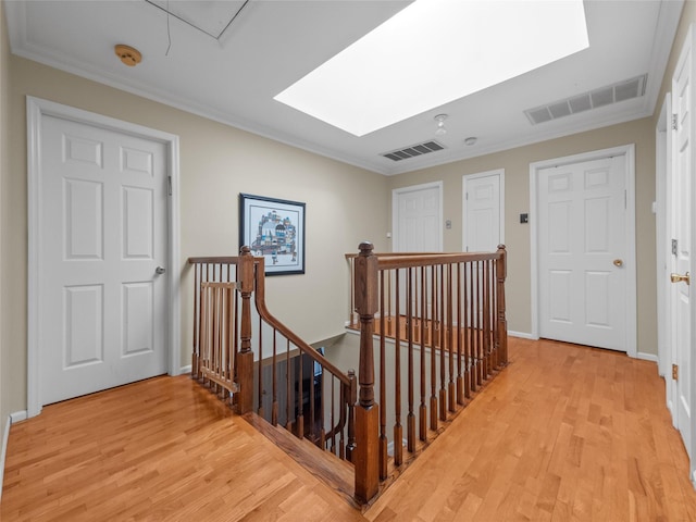 11 Balanchine Ct, Airmont, NY 10952 - staircase with a skylight, wood finished floors, crown molding, and attic access
