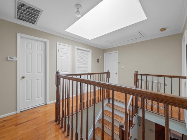 11 Balanchine Ct, Airmont, NY 10952 - corridor featuring attic access, an upstairs landing, crown molding, light wood-style floors, and baseboards