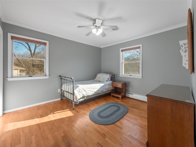 11 Balanchine Ct, Airmont, NY 10952 - bedroom with a baseboard radiator, wood finished floors, baseboards, ornamental molding, and a ceiling fan