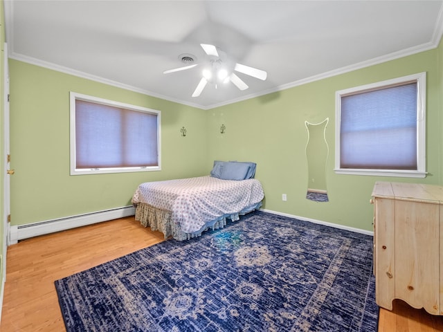 11 Balanchine Ct, Airmont, NY 10952 - bedroom featuring baseboard heating, ornamental molding, wood finished floors, a ceiling fan, and baseboards