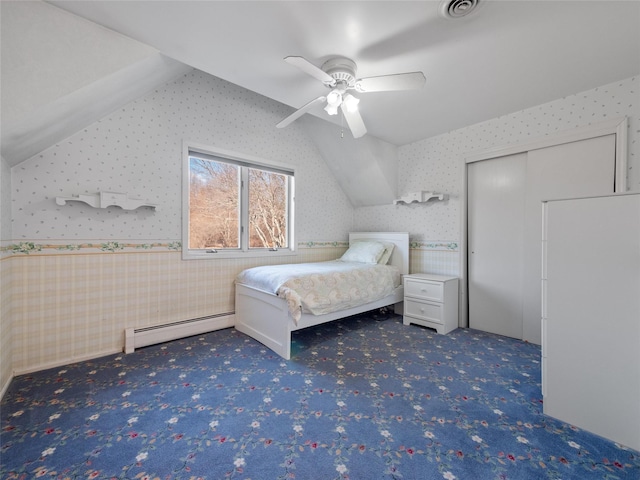11 Balanchine Ct, Airmont, NY 10952 - bedroom featuring a baseboard heating unit, wallpapered walls, vaulted ceiling, carpet floors, and a ceiling fan