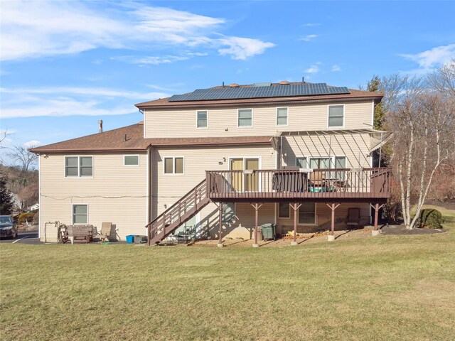 11 Balanchine Ct, Airmont, NY 10952 - back of property with a deck, solar panels, and a yard
