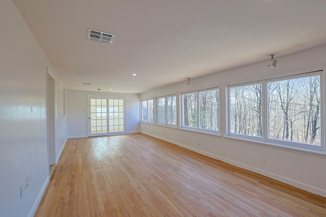 spare room featuring light hardwood / wood-style flooring