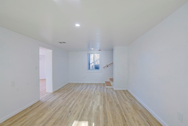 unfurnished room with light wood-type flooring