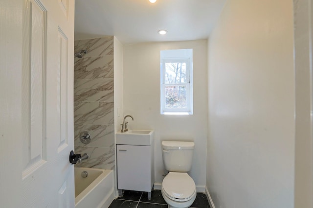 full bathroom featuring tiled shower / bath, tile patterned flooring, vanity, and toilet