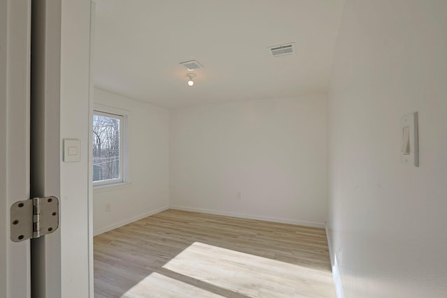 unfurnished room featuring light hardwood / wood-style flooring