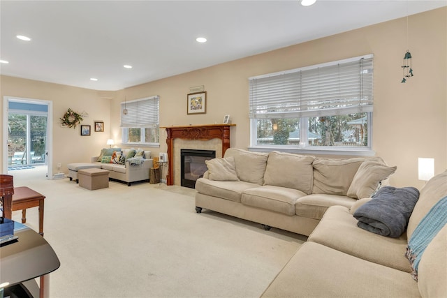 carpeted living room with a fireplace