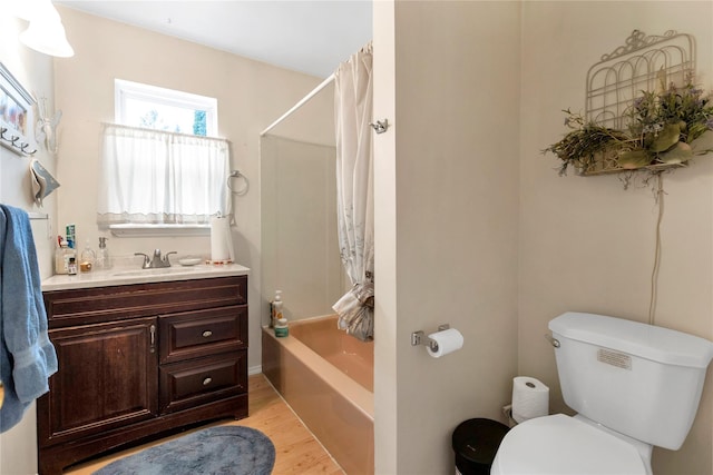 full bathroom with toilet, shower / bath combination with curtain, wood-type flooring, and vanity