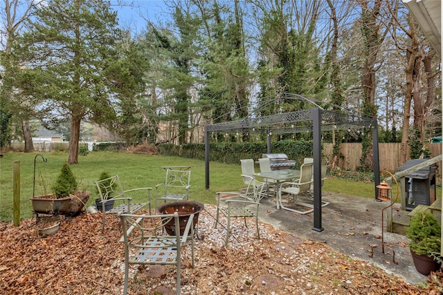 view of yard featuring a patio area and a fire pit