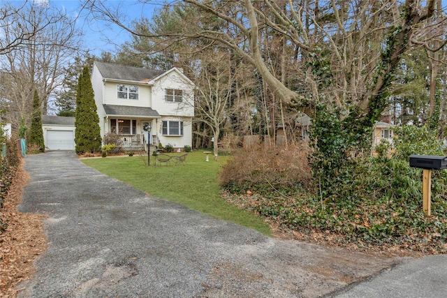 view of front of home featuring covered porch and a front lawn