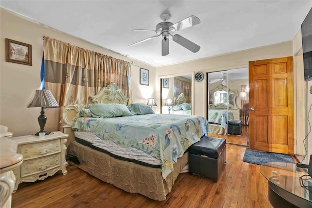 bedroom featuring wood-type flooring and ceiling fan