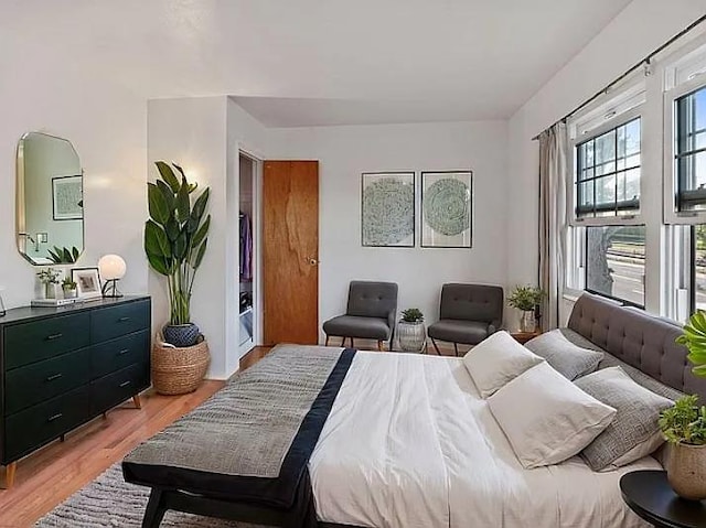 bedroom with light wood-type flooring