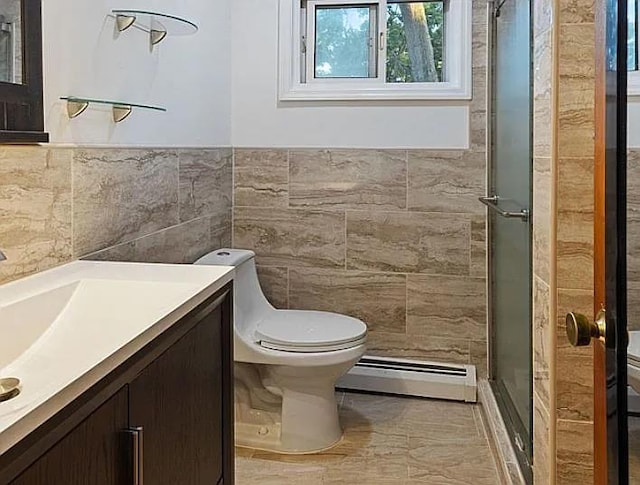 bathroom with vanity, a baseboard radiator, tile walls, and toilet