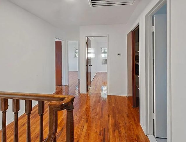 corridor featuring hardwood / wood-style floors