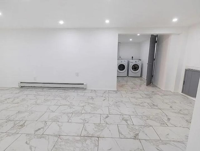 laundry room with washer and dryer and a baseboard radiator