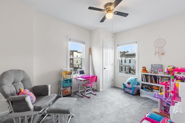 game room featuring ceiling fan and light colored carpet