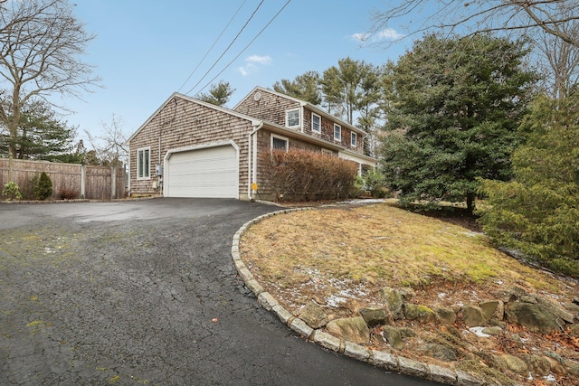 view of side of property featuring a garage