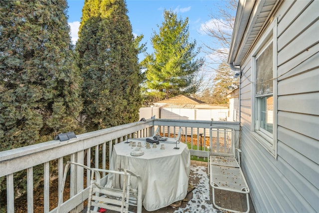 wooden balcony featuring a deck