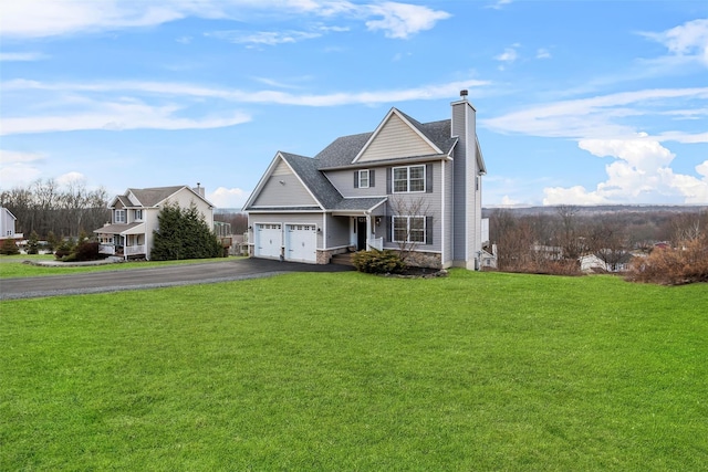 view of front of home featuring a front lawn and a garage