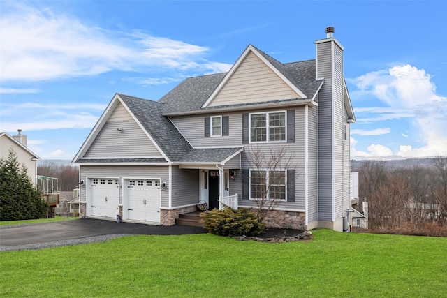 front facade featuring a front yard and a garage