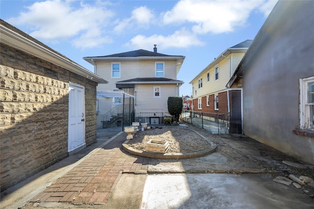 back of house with a patio