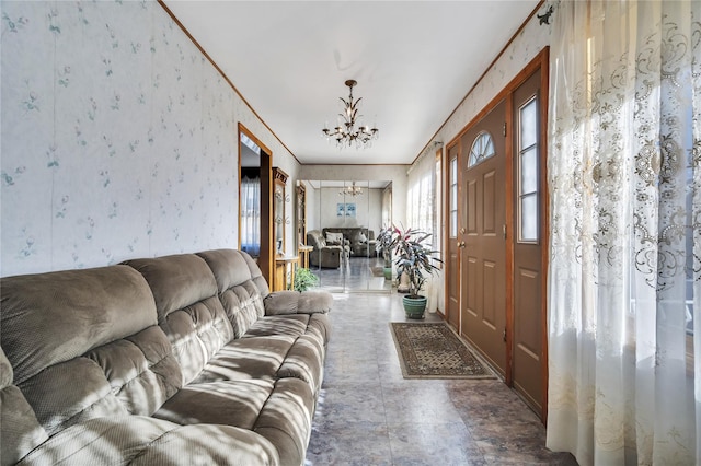 interior space with crown molding and a chandelier