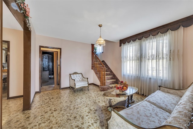 living room featuring an inviting chandelier