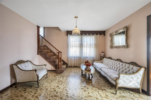 living room featuring a chandelier