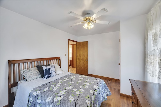 bedroom featuring light hardwood / wood-style floors and ceiling fan